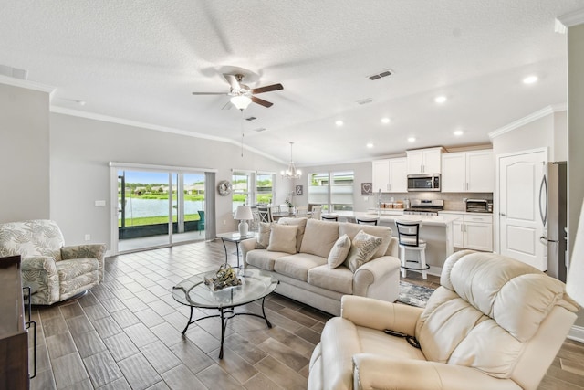 100 Dove Tree Ln, Saint Augustine, FL 32095 - living area featuring a ceiling fan, ornamental molding, lofted ceiling, recessed lighting, and a water view