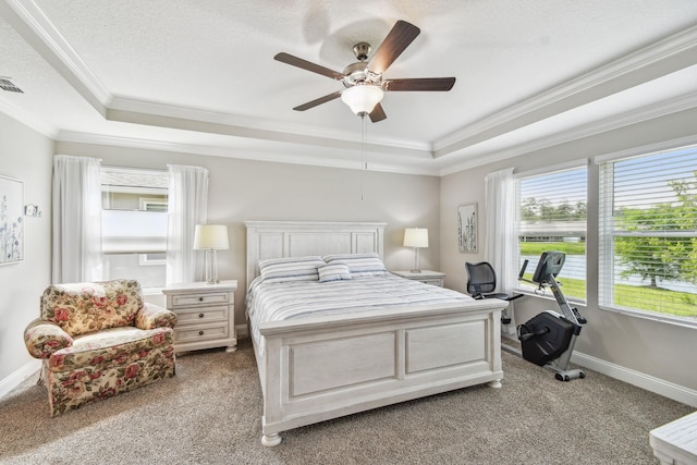 100 Dove Tree Ln, Saint Augustine, FL 32095 - bedroom featuring a tray ceiling, crown molding, light colored carpet, and a ceiling fan