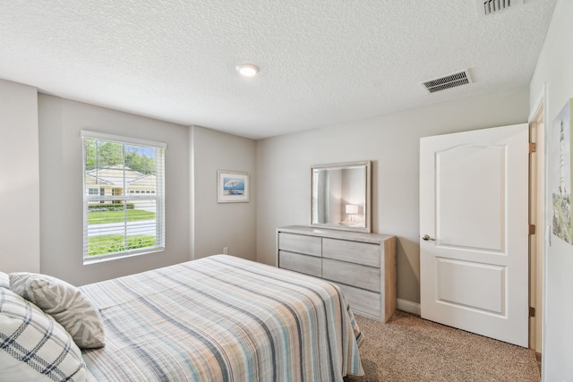 100 Dove Tree Ln, Saint Augustine, FL 32095 - bedroom featuring light carpet and a textured ceiling