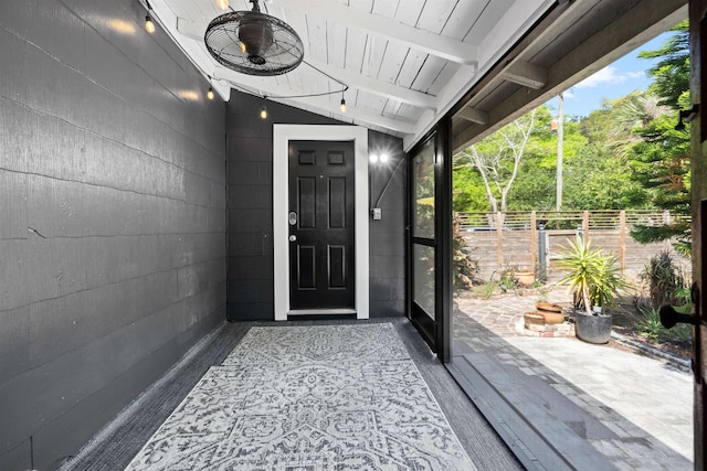 doorway to property featuring fence and a patio area