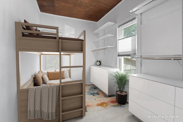 carpeted bedroom featuring wood ceiling