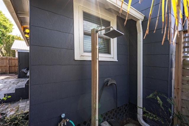 view of property exterior with fence