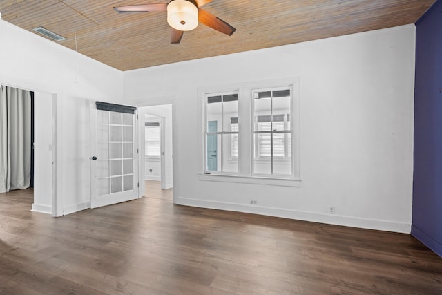 unfurnished room with baseboards, visible vents, a ceiling fan, wood finished floors, and wooden ceiling