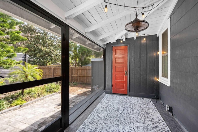 doorway to property with fence