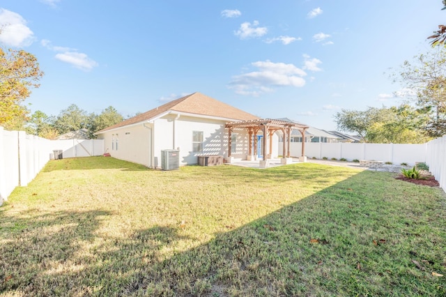 back of property featuring a pergola, a yard, and central AC