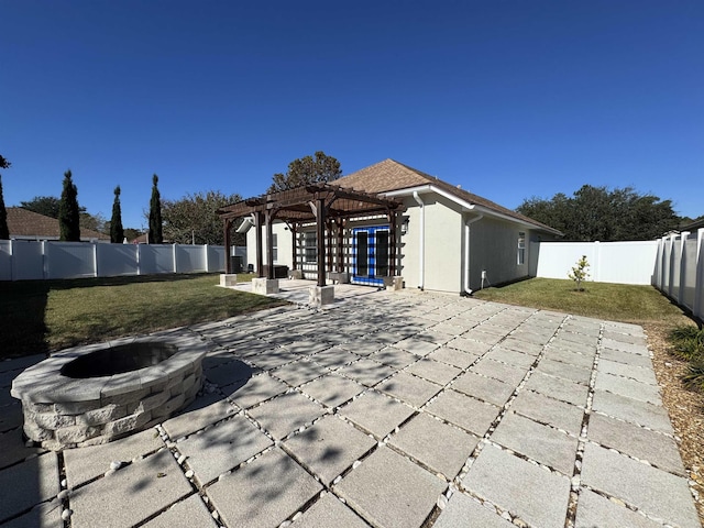 view of patio with a pergola and an outdoor fire pit