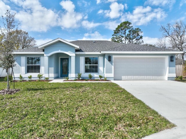 ranch-style home with a front yard and a garage