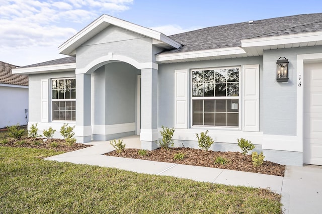 property entrance with a yard