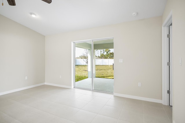 tiled empty room with ceiling fan