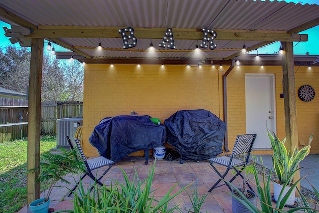 view of patio / terrace with cooling unit, fence, and grilling area