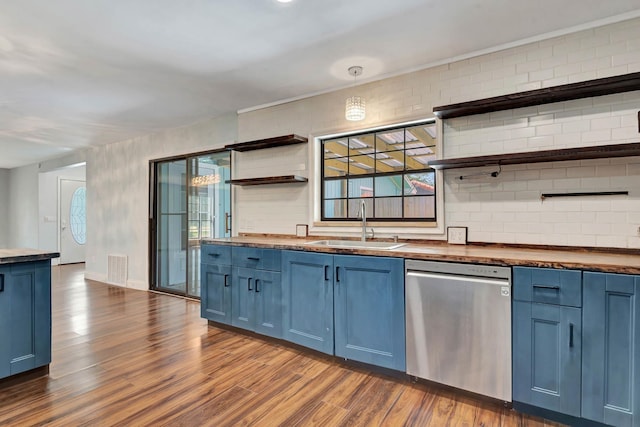 132 Southwind Cir, Saint Augustine, FL 32080 - kitchen featuring stainless steel dishwasher, blue cabinetry, open shelves, and dark wood-style flooring