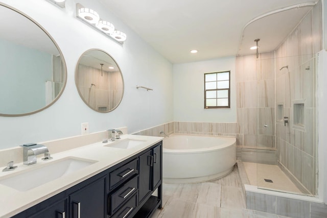 132 Southwind Cir, Saint Augustine, FL 32080 - bathroom featuring a garden tub, tiled shower, double vanity, and recessed lighting