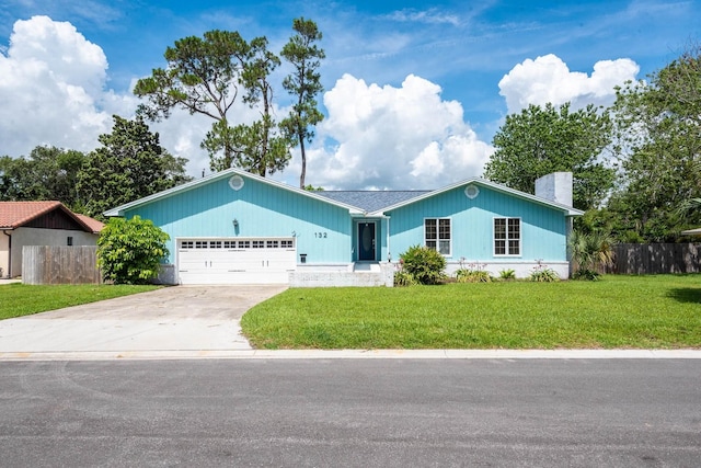132 Southwind Cir, Saint Augustine, FL 32080 - single story home featuring a chimney, an attached garage, and driveway