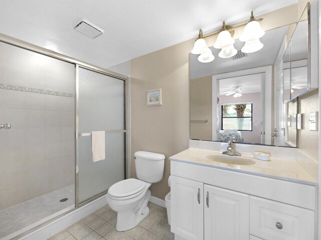 4250 A1A S L25, Saint Augustine, FL 32080 - full bathroom with toilet, a shower stall, vanity, tile patterned flooring, and ceiling fan