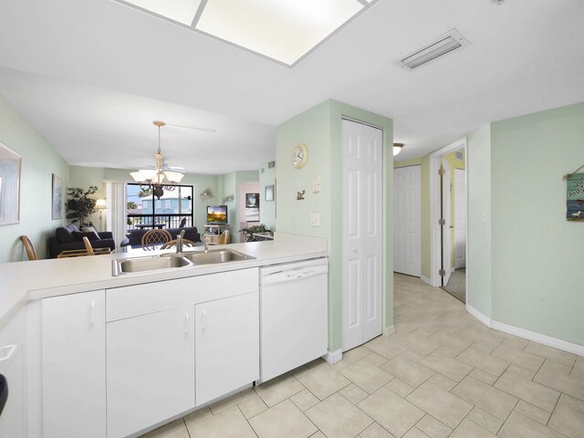 4250 A1A S L25, Saint Augustine, FL 32080 - kitchen featuring white dishwasher, a sink, light countertops, a chandelier, and white cabinets