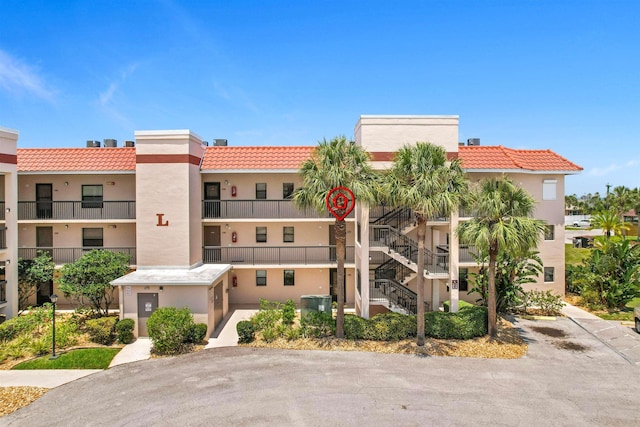 4250 A1A S L25, Saint Augustine, FL 32080 - view of property featuring stairs and central AC unit