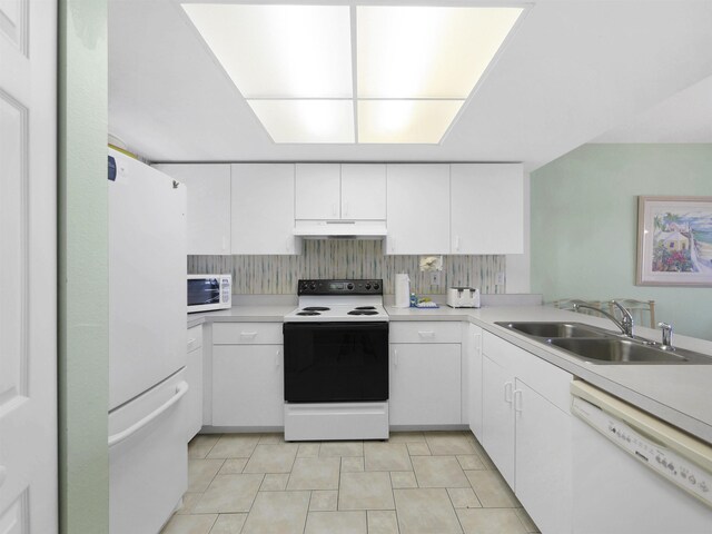 4250 A1A S L25, Saint Augustine, FL 32080 - kitchen with white appliances, under cabinet range hood, a sink, white cabinetry, and light countertops