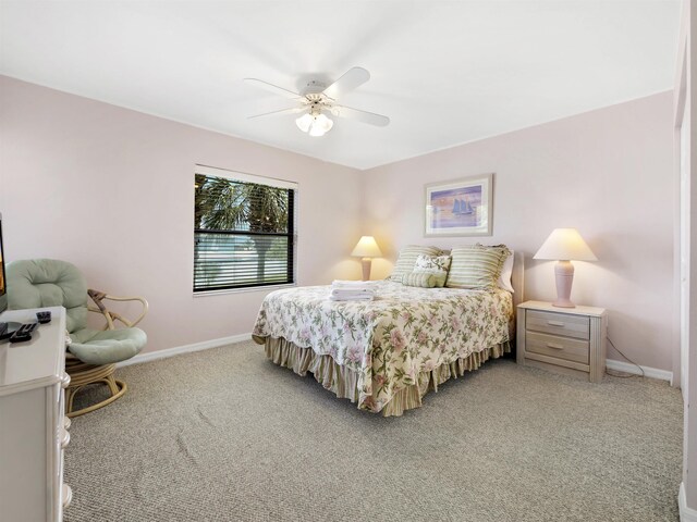 4250 A1A S L25, Saint Augustine, FL 32080 - bedroom featuring light colored carpet, baseboards, and ceiling fan