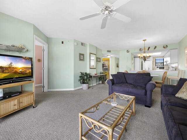 4250 A1A S L25, Saint Augustine, FL 32080 - carpeted living room with a chandelier, a ceiling fan, and baseboards