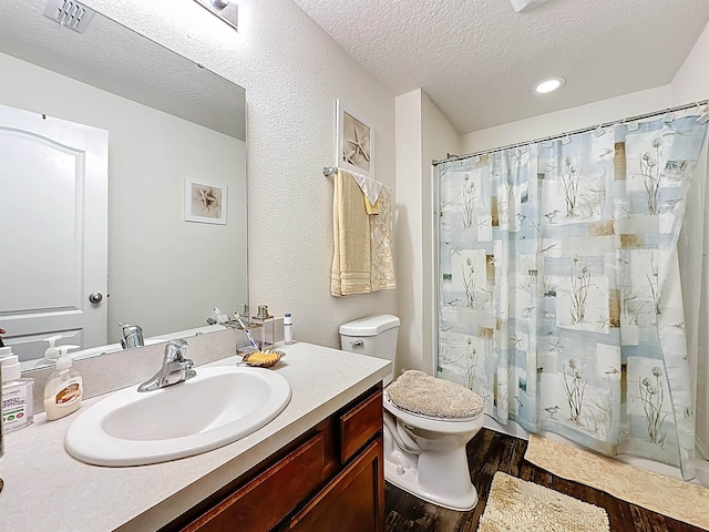 348 Ashby Landing Way, Saint Augustine, FL 32086 - bathroom with wood finished floors, vanity, a textured ceiling, shower / bath combo, and recessed lighting