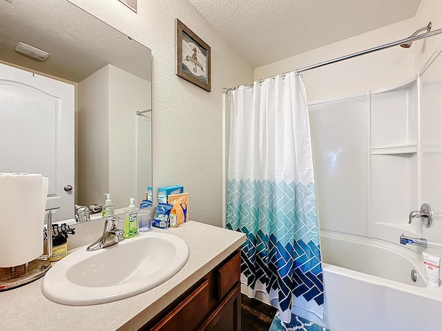 348 Ashby Landing Way, Saint Augustine, FL 32086 - bathroom with a textured ceiling, vanity, and shower / bathtub combination with curtain