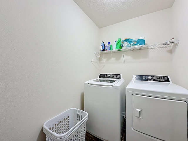 348 Ashby Landing Way, Saint Augustine, FL 32086 - laundry area featuring independent washer and dryer and a textured ceiling