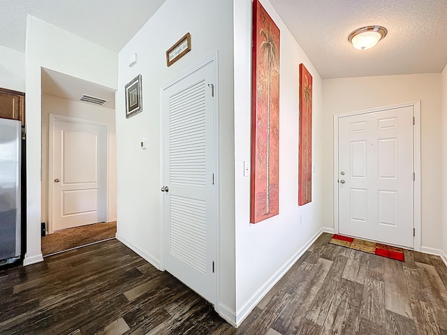 348 Ashby Landing Way, Saint Augustine, FL 32086 - corridor featuring dark wood-type flooring and a textured ceiling