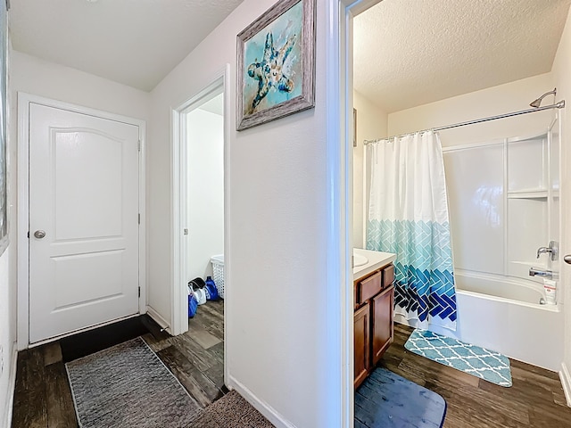 348 Ashby Landing Way, Saint Augustine, FL 32086 - bathroom with wood finished floors, shower / bathtub combination with curtain, vanity, and a textured ceiling