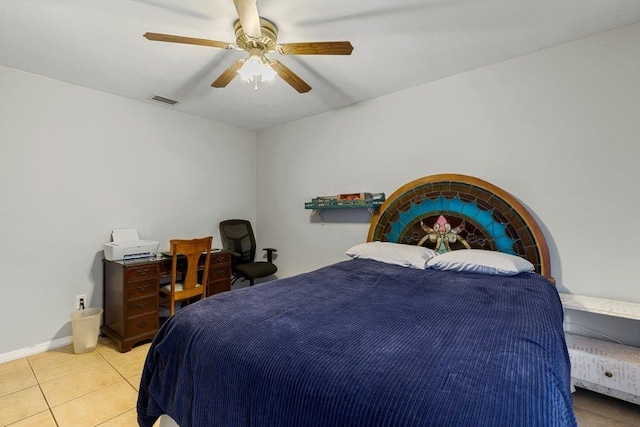 bedroom featuring tile patterned floors, ceiling fan, and baseboards