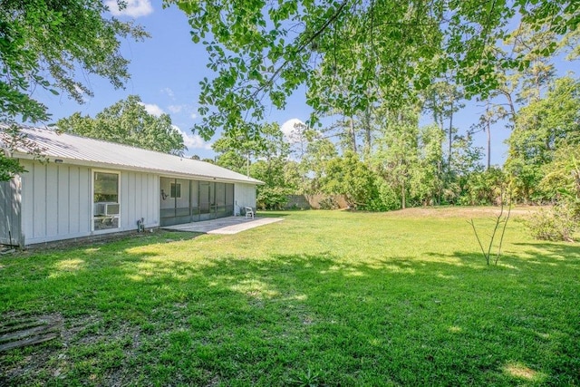 view of grassy yard featuring a patio