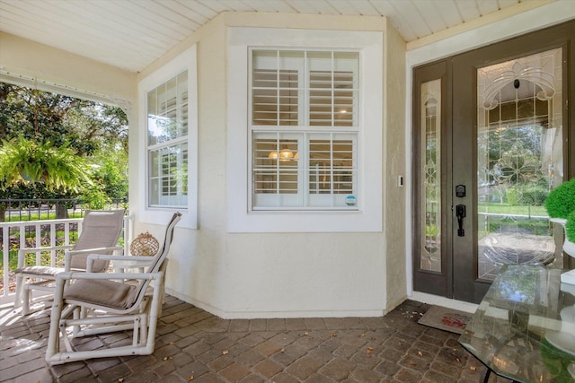 501 Olympic Cir, Saint Augustine, FL 32092 - entrance to property with a porch and stucco siding