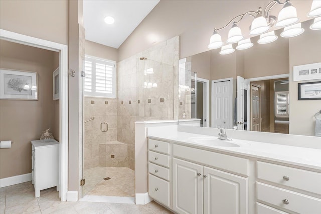 501 Olympic Cir, Saint Augustine, FL 32092 - bathroom with lofted ceiling, a shower stall, vanity, and tile patterned flooring