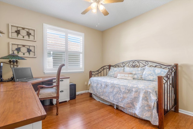 501 Olympic Cir, Saint Augustine, FL 32092 - bedroom with wood finished floors, a desk, and a ceiling fan