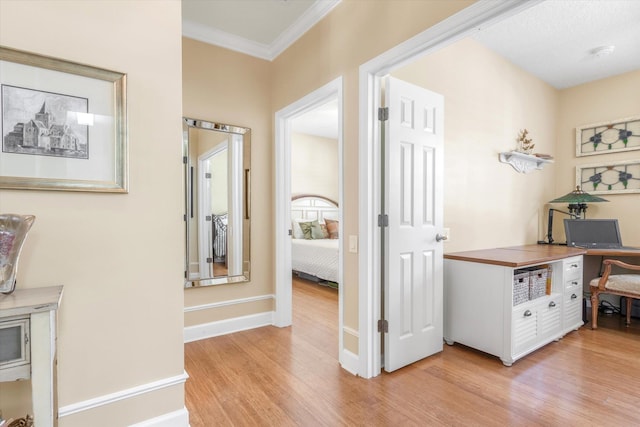 501 Olympic Cir, Saint Augustine, FL 32092 - hallway featuring light wood-style floors, ornamental molding, and a desk