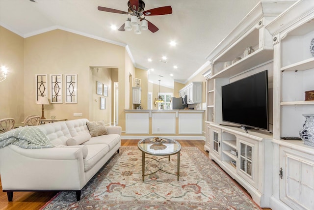501 Olympic Cir, Saint Augustine, FL 32092 - living room with vaulted ceiling, ornamental molding, a ceiling fan, and light wood-type flooring