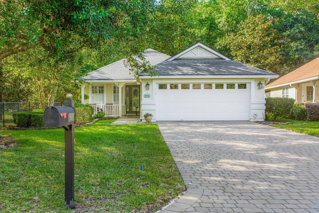 501 Olympic Cir, Saint Augustine, FL 32092 - single story home with decorative driveway, an attached garage, roof with shingles, and a porch