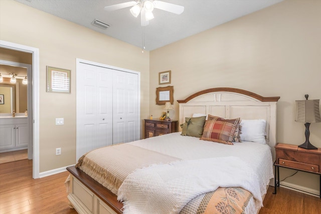 501 Olympic Cir, Saint Augustine, FL 32092 - bedroom with wood finished floors, a closet, and ceiling fan