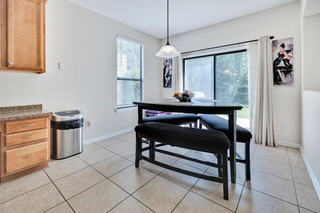 dining space with light tile patterned flooring