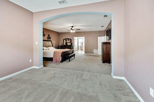 bedroom with light colored carpet and ceiling fan