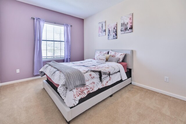 bedroom with light carpet