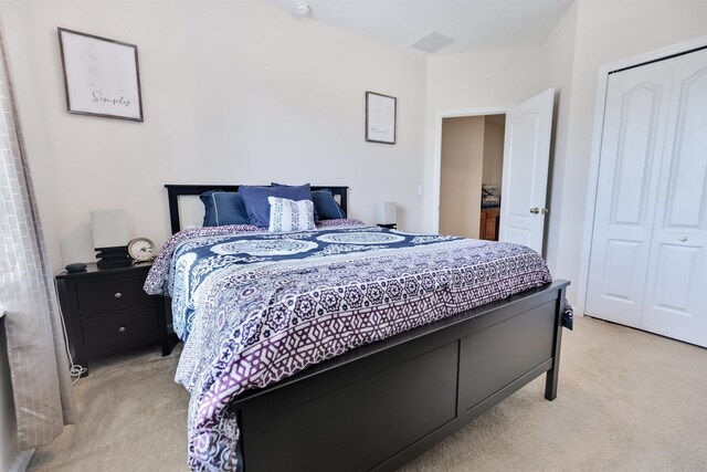 carpeted bedroom with a closet