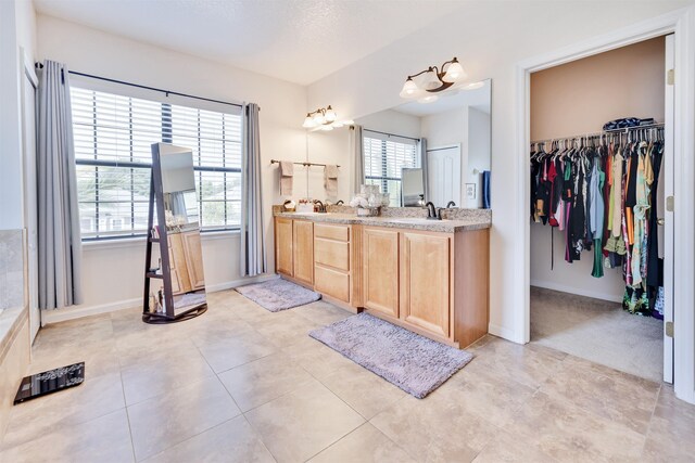 bathroom featuring vanity and tile patterned flooring