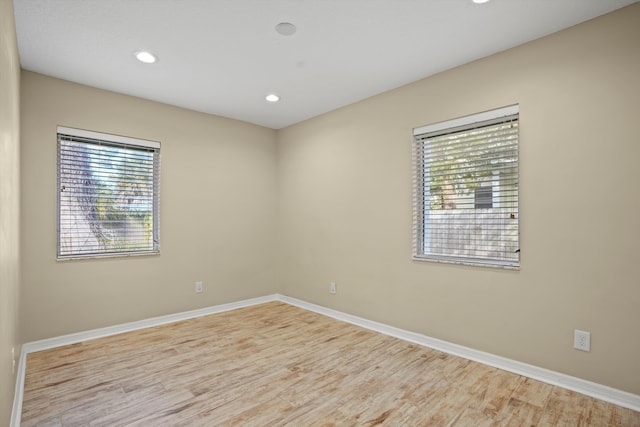 spare room featuring light wood-type flooring