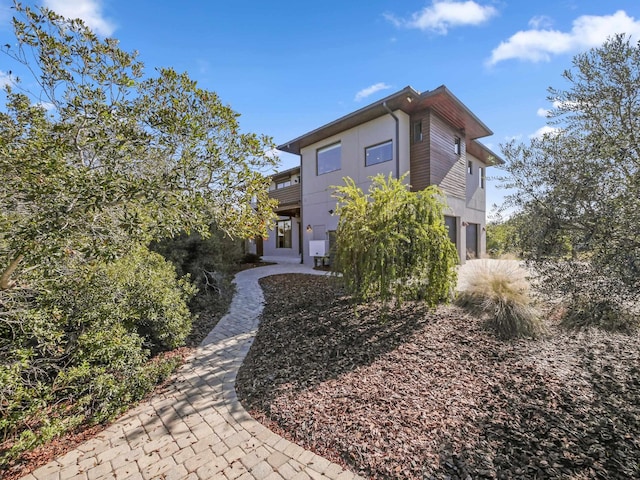 rear view of house featuring a garage