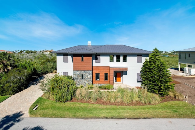 view of front of property with central AC