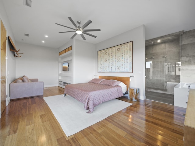 bedroom featuring wood-type flooring, connected bathroom, and ceiling fan