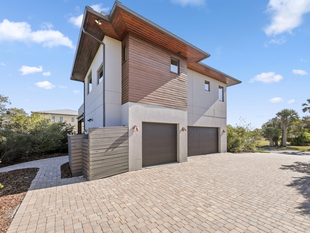 view of side of property with a garage