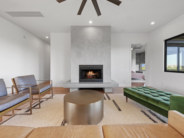 living room featuring hardwood / wood-style flooring and a fireplace