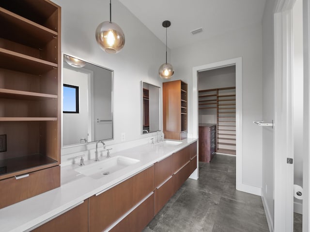 bathroom featuring vanity and concrete flooring