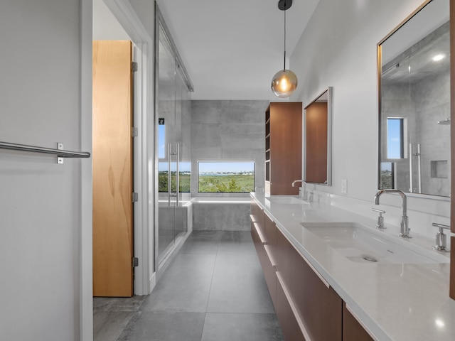 bathroom with vanity and independent shower and bath